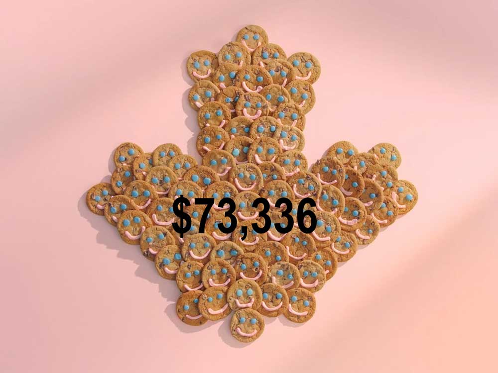 Tim Hortons Smile Cookies arranged into the shape of a maple leaf, with the amount raised during the 2022 campaign superimposed on the photo: $73,336